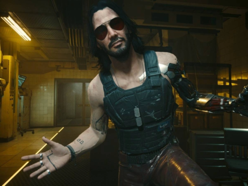 Johnny Silverhand, personagem de Cyberpunk 2077 interpretado por Keanu Reeves, usando óculos escuros e exibindo seu braço cibernético.